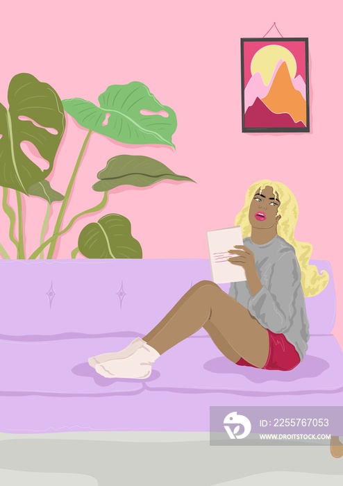 woman reading a book on sofa
