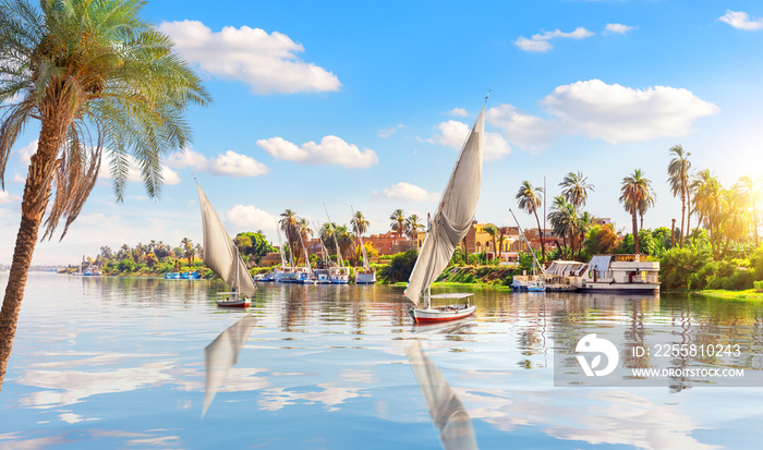 Sailboats in the Nile and the view of Luxor, Egypt