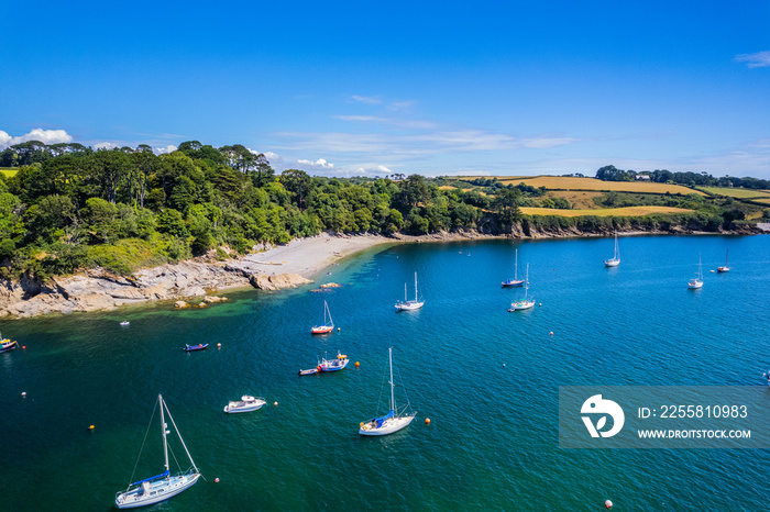 Aerial shot of Helford River with boats on summer day