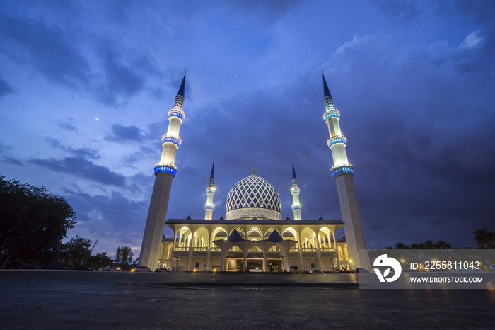 The Sultan Salahuddin Abdul Aziz Shah mosque during sunset, Malaysia. Image has grain or blurry or noise and soft focus when view at full resolution. (Shallow DOF, slight motion blur)