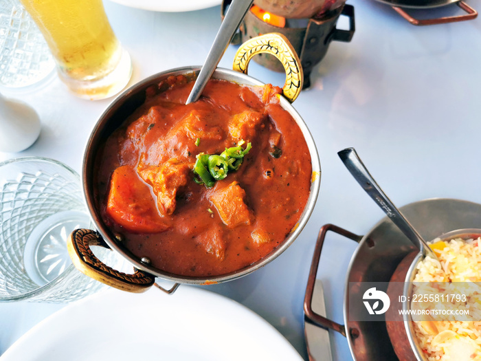 Indian lamb curry in a copper bowl.