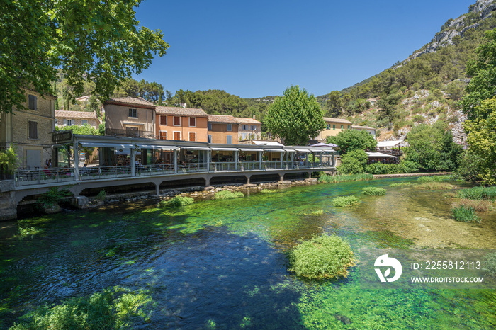 The natural landscape with green trees and river of the famous travel destination, Fontaine-de-Vaucluse, a small town in Provence, France