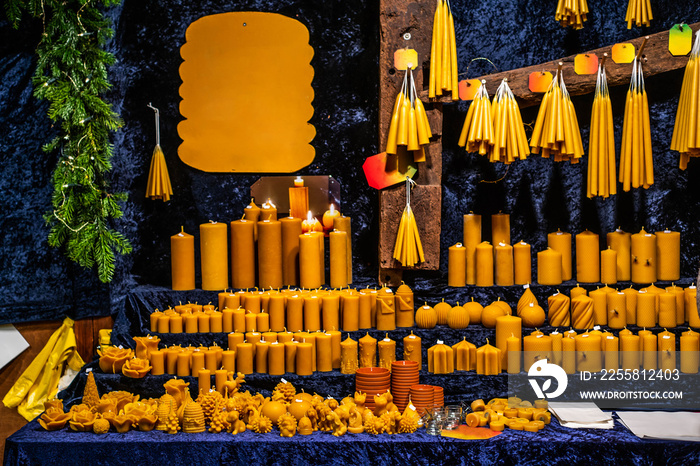 Romantic german Christmas market with illuminated shop for colorful candles - candle maker