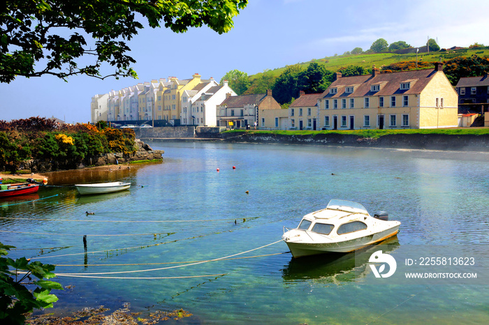 Picturesque harbor with fishing boat in the village of Cushendun, Antrim, Northern Ireland