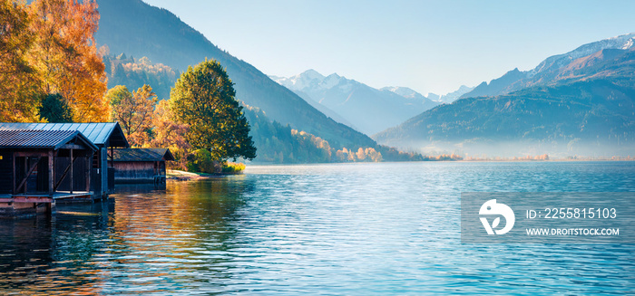 Sunny morning panorama of Zell lake. Picturesque autumn view of Austrian Alps, with Grossglockner peak on background. Beauty of nature concept background.