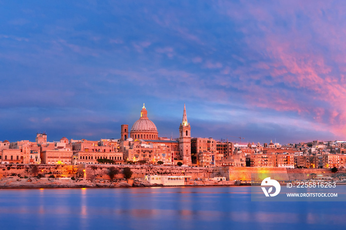 Valletta Skylineat at beautiful sunset from Sliema with churches of Our Lady of Mount Carmel and St. Paul’s Anglican Pro-Cathedral, Valletta, Capital city of Malta