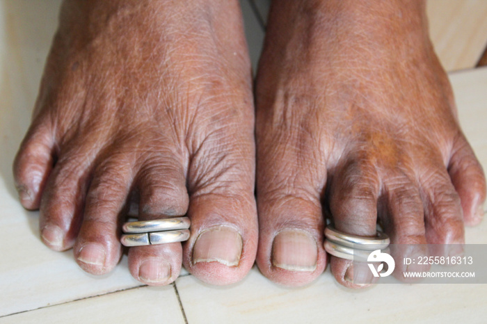 Silver Bichiya jewelry, Old women feet , foot-worn jewelry , Woman with beautiful feet on tiles