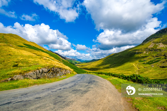 Lonely road among the mountains at the beautiful Lake District in England