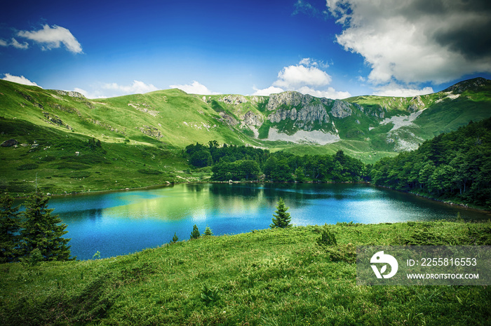 Panoramic view of beautiful mountain range with crystal clear lake