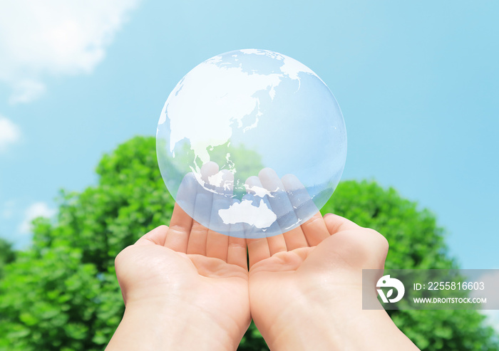 hand holding globe nature background