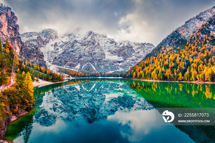 First snow on Braies Lake. Colorful autumn landscape in Italian Alps, Naturpark Fanes-Sennes-Prags, Dolomite, Italy, Europe. Beauty of nature concept background.