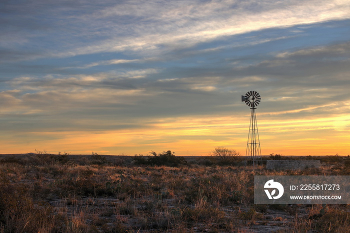 Winmill in the Texas Desert at Sunset