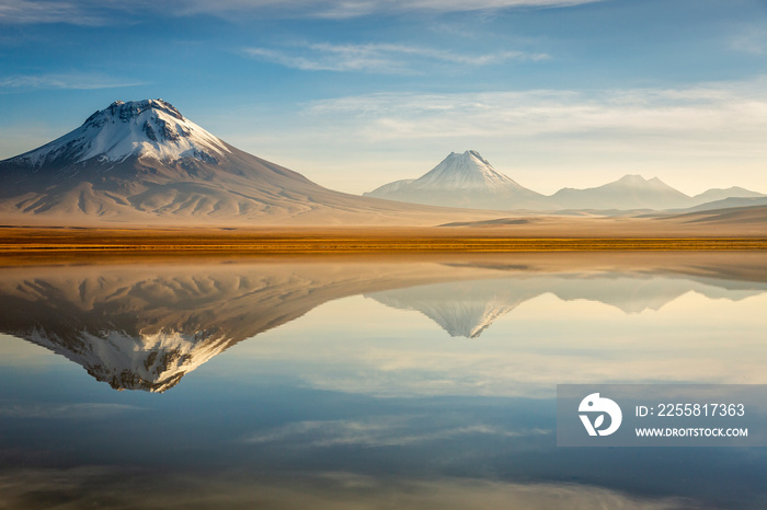 Idyllic Lake Lejia reflection and volcanic landscape in Atacama desert, Chile