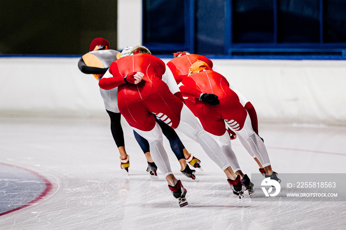 group of men speed skaters training in speed skating