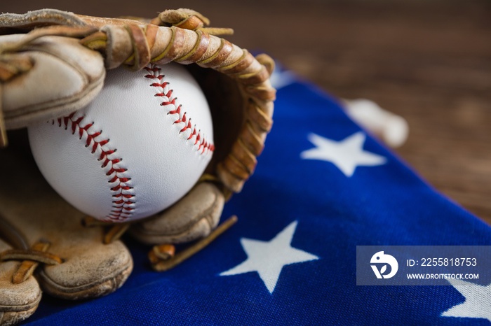 Baseball and gloves on an American flag