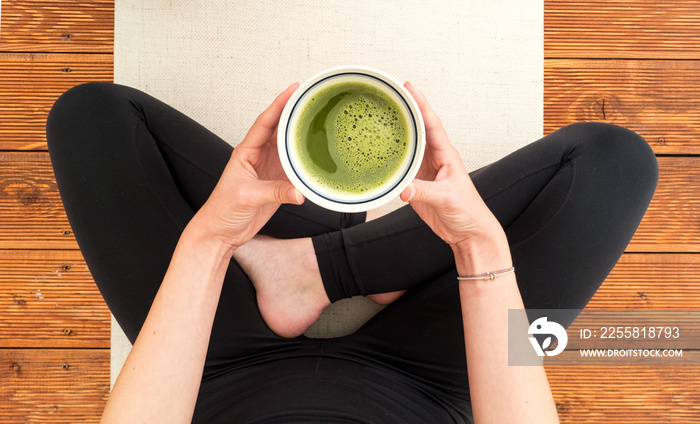 Cup of matcha in a meantime during yoga practise