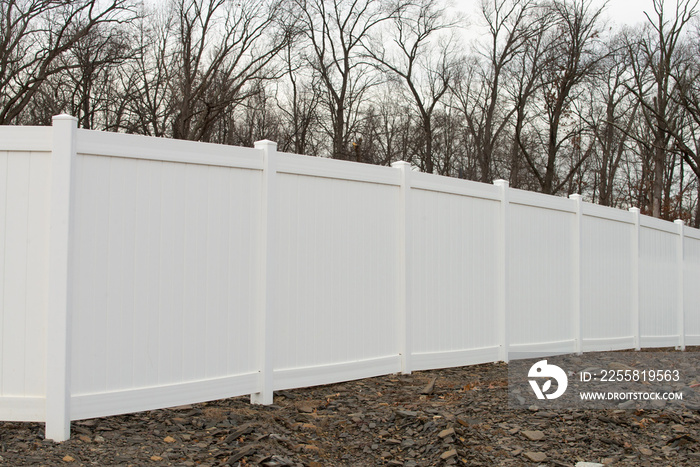 white vinyl fence in residential neighborhood