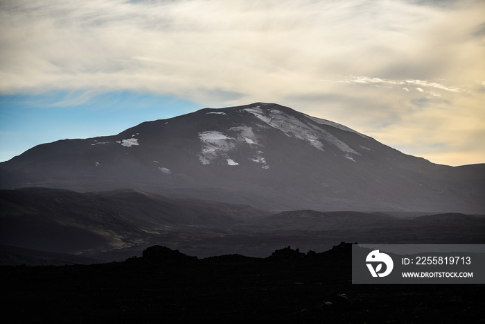 The imposing, menacing Hekla stratovolcano, one of Iceland’s most active volcanoes, seen from the road from Landmannalaugar through the volcanic landscape of the Central Highlands of Iceland