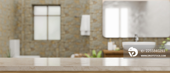 Empty space on marble bathroom countertop over blurred modern stone bathroom