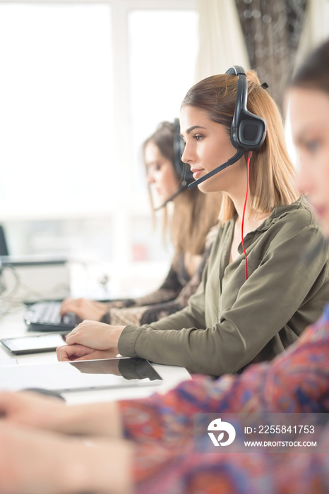 Group of busy young businesswomen working in a call center