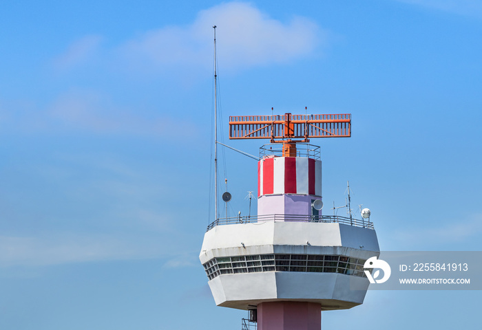 Radar  air traffic control tower in international airpor under blue sky.