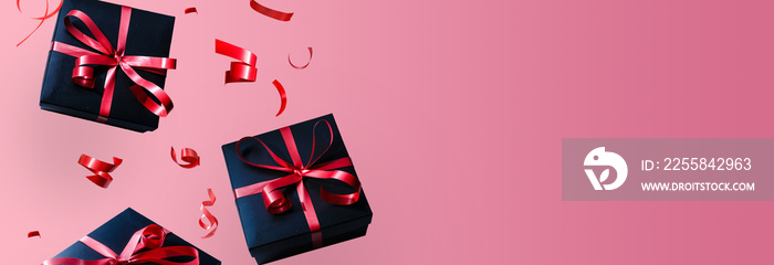 Black gift box with red ribbon and bow, over red background.