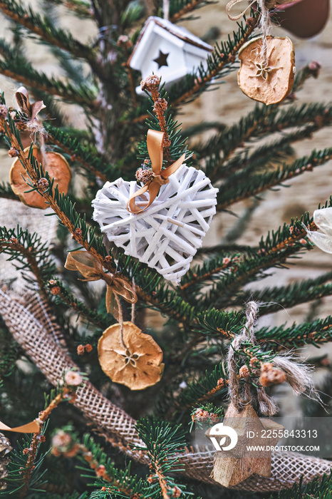 Christmas tree decorated with heart-shaped wicker wreath and other handmade Christmas zero-waste orn