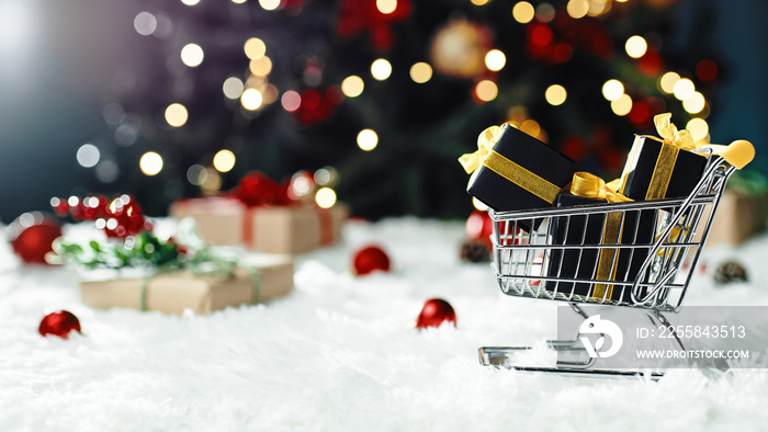 Shopping cart with Christmas gifts box