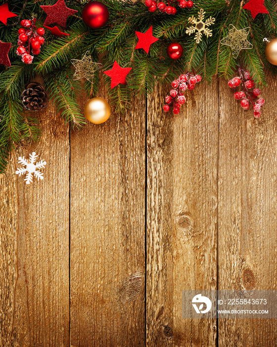 Christmas wooden background with decoration and fir tree. View with copy space.