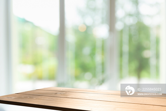 Wooden table on defocuced window with curtain background