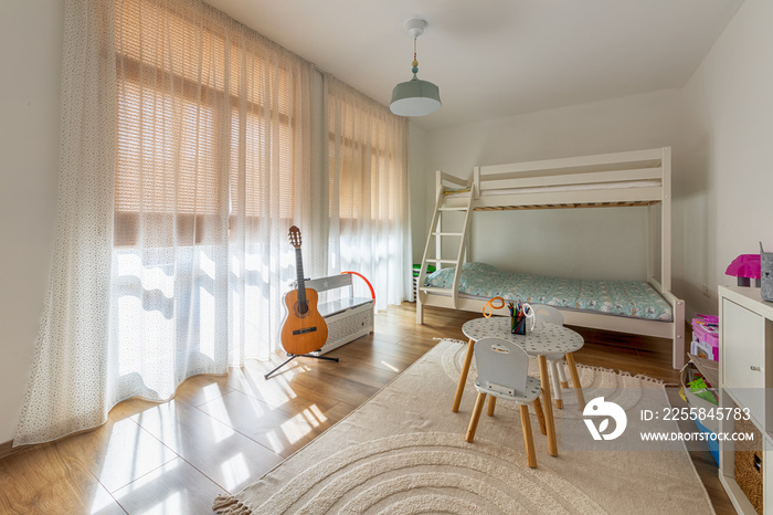 New modern childrens room with bunk bed. New home. Interior photography. Wooden floor.