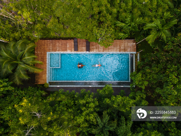 aerial drone view of swimming pool in the jungle of Krabi Thailand, aerial view with a drone above s