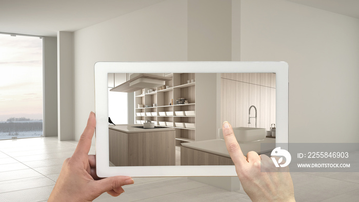 Augmented reality concept. Hand holding tablet with AR application used to simulate furniture and de