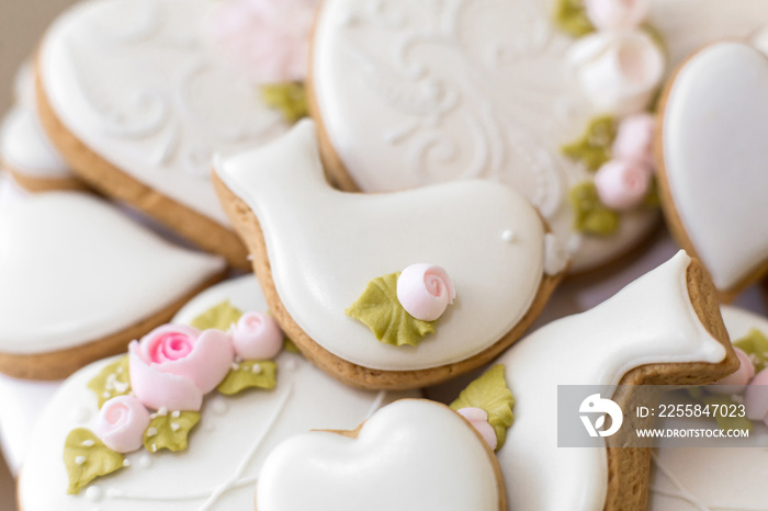 Closeup of gingerbread cookies in a white glaze. Stylish pastries as a decoration for the holidays.