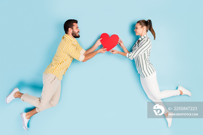 Top view above high angle flat lay flatlay lie concept full length body size view of nice couple fly