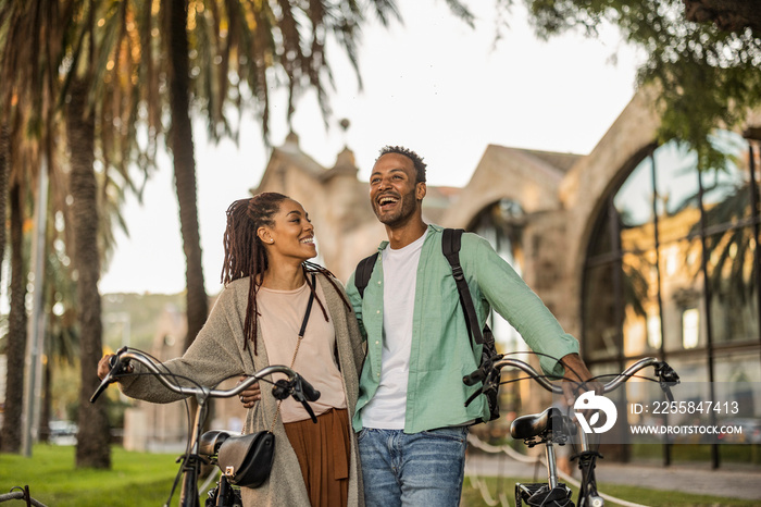 African American couple, wearing European city, honeymoon, Valentines Day. rent bikes to ride aroun