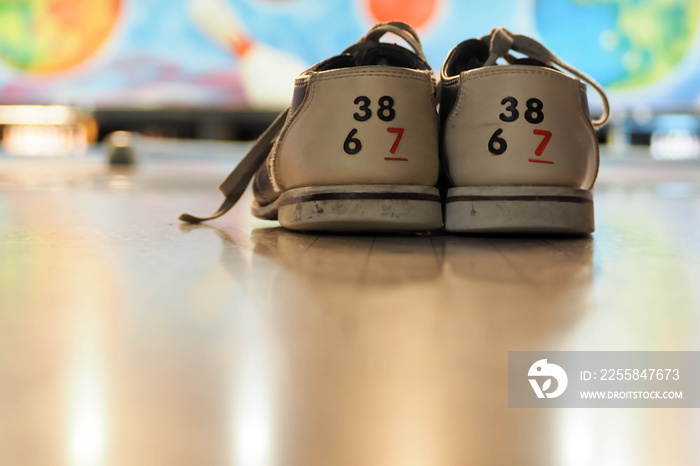 special size thirty eight bowling shoes rear view in front of the tracks