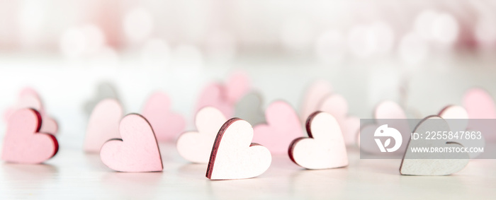 Backround or banner for valentines day, mothers day with hearts and bokeh in light pink