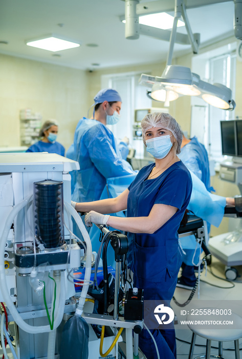 Artificial lung ventilation monitor in the intensive care unit. Nurse with medical equipment. Ventil