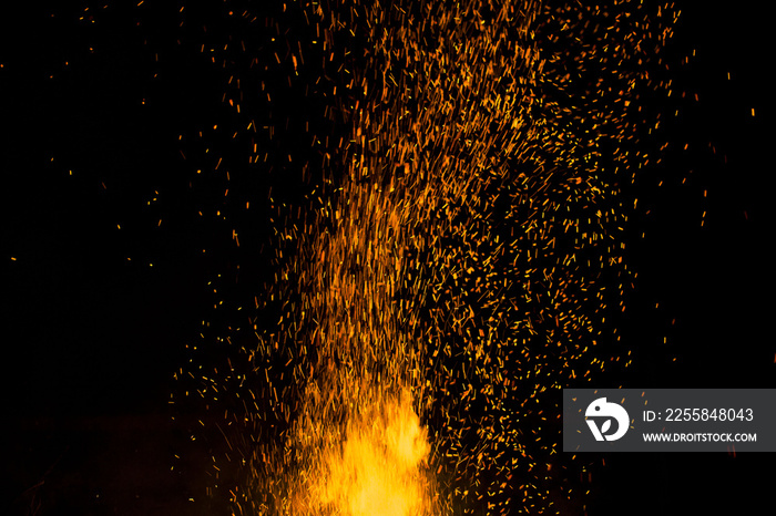 bonfire spark in the dark sky in night, shallow focus