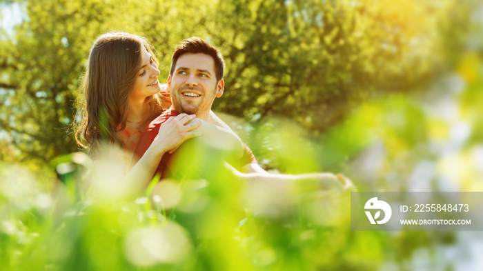 spring - a lovely girlfriend and boyfriend is enjoying sunny day outside