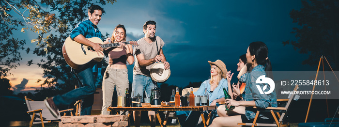 summer party camping of friends group with guitar music, happy young woman and smiling man having fu