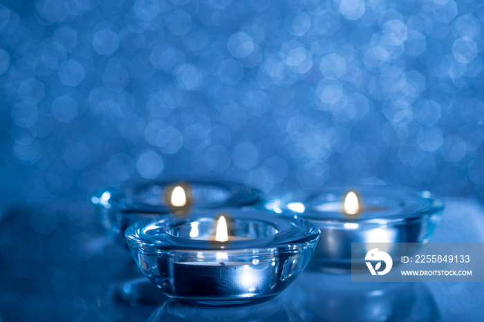 Christmas composition of candles on a blue background