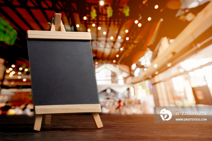 empty food menu board with black mockup space with blurred restaurant background