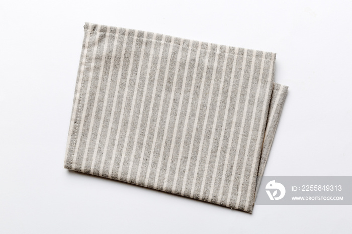 top view with gray kitchen napkin isolated on table background. Folded cloth for mockup with copy sp