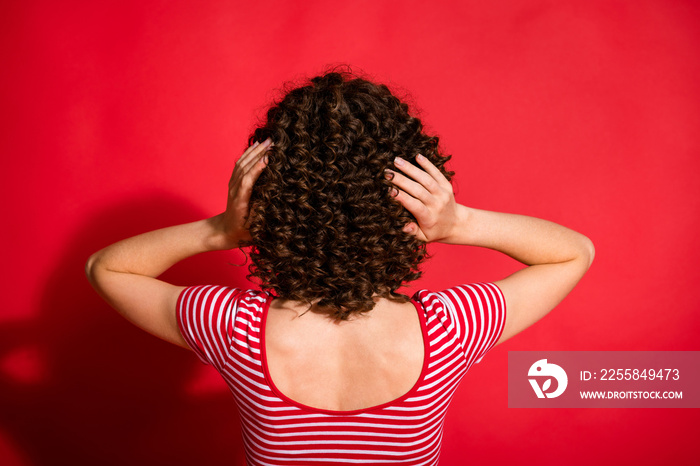 Back rear spine view photo of young girl hairdo spa treatment isolated over red color background