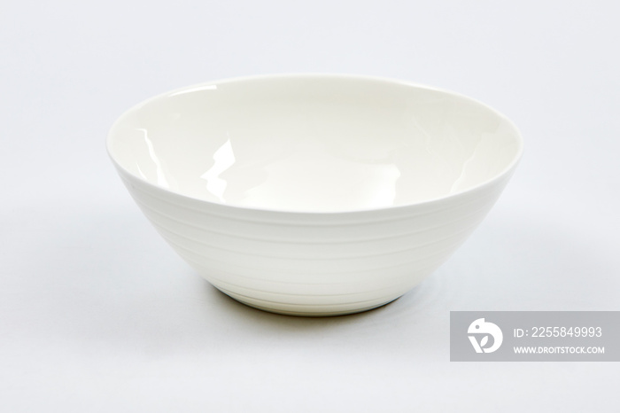 White ceramic bowl on white background