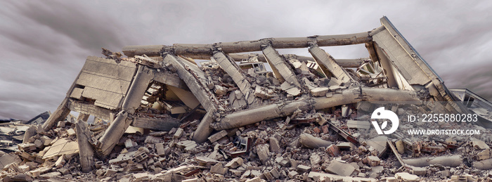 Collapsed concrete industrial building with dramatic sky and another concrete building in background. Disaster scene full of debris, dust and damaged house