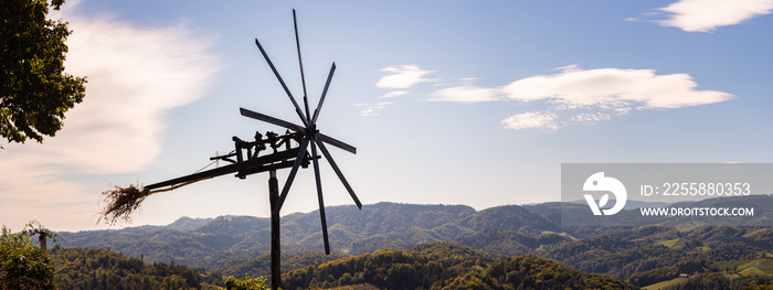 Styrian Tuscany like Vineyard with windmill, Panorama of grape crops in Slovenia spicnik.