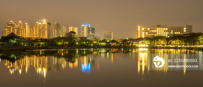 Cityscape at night with reflection of building in west Surabaya, Surabaya city, Indonesia. Wide angle photo